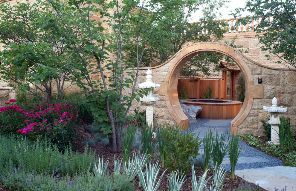 Photo of an asian courtyard partial sun garden in Denver with a garden path and natural stone pavers.
