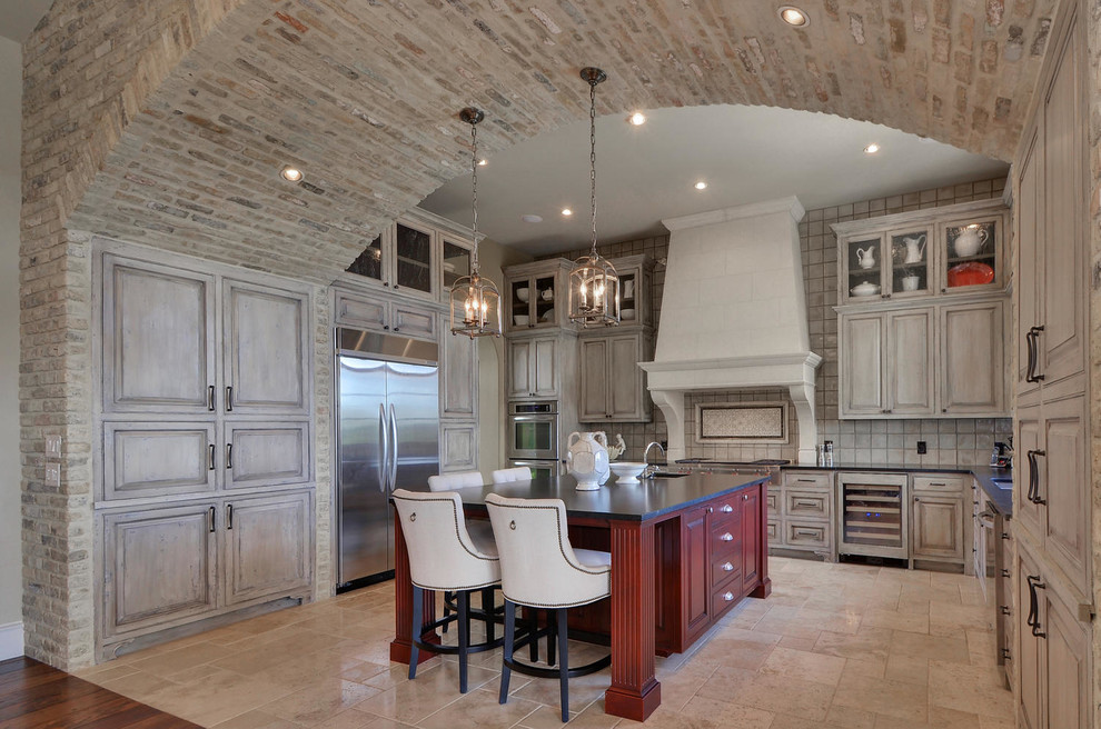 Inspiration for a traditional u-shaped kitchen in Austin with raised-panel cabinets, grey cabinets, grey splashback, stainless steel appliances and with island.