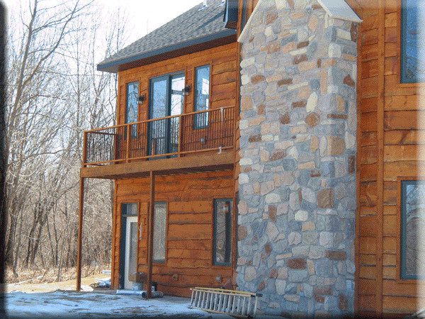 Rustic exterior home idea in Cedar Rapids