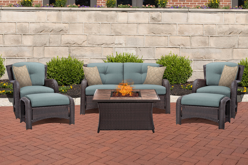 Transitional backyard home design photo with a fire pit