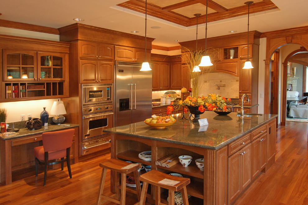 Huge medium tone wood floor kitchen photo in Minneapolis with an undermount sink, medium tone wood cabinets, beige backsplash, stainless steel appliances and an island