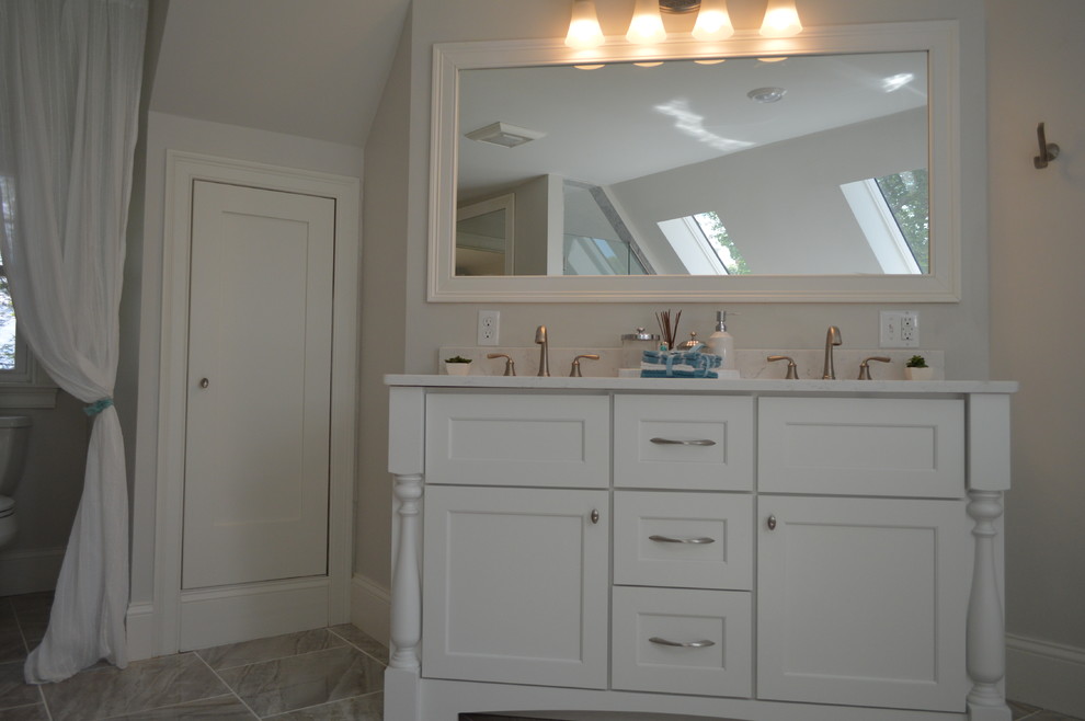 Mid-sized transitional master beige tile and cement tile bathroom photo in Boston with dark wood cabinets, a hot tub, an undermount sink, beige countertops, recessed-panel cabinets, beige walls and quartzite countertops