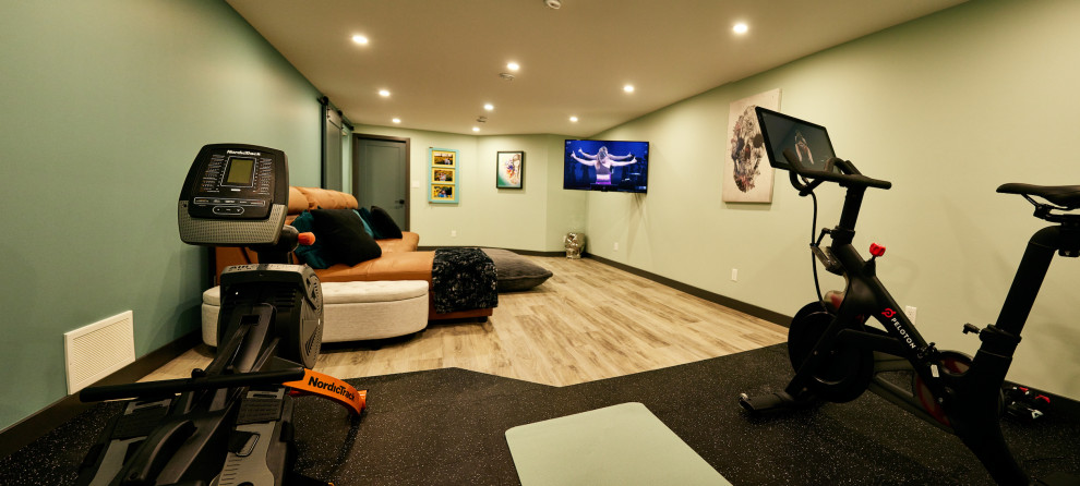 Inspiration for a mid-sized traditional multipurpose gym in Edmonton with green walls, vinyl floors and grey floor.