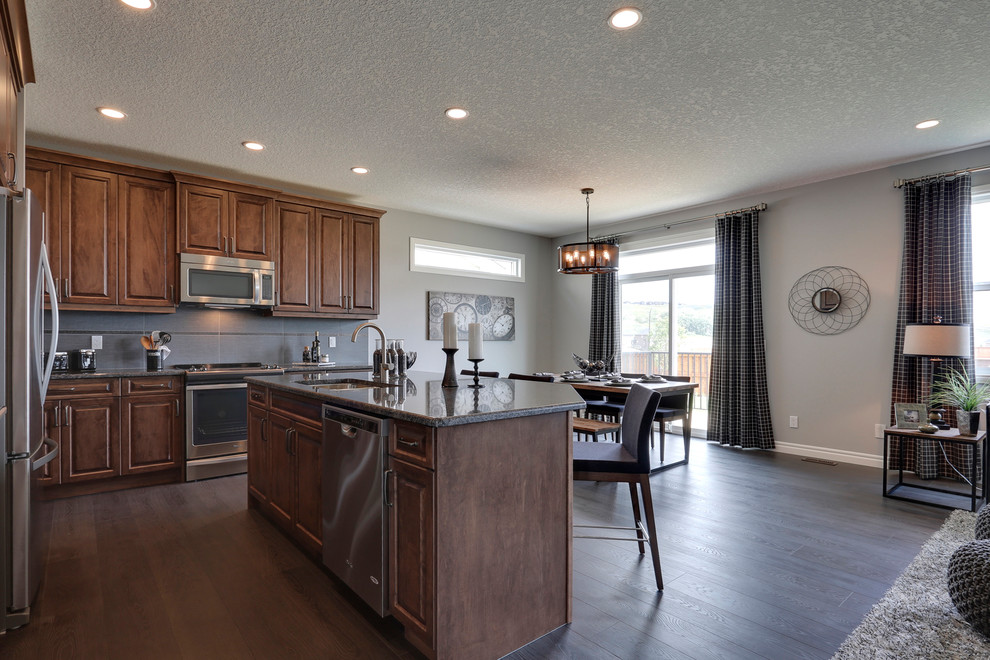 Example of a transitional kitchen design in Calgary