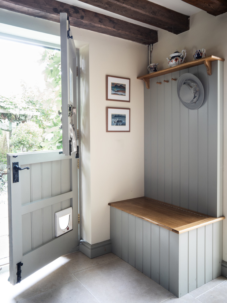 Inspiration for a country mudroom in West Midlands with white walls, a dutch front door, a gray front door and grey floor.