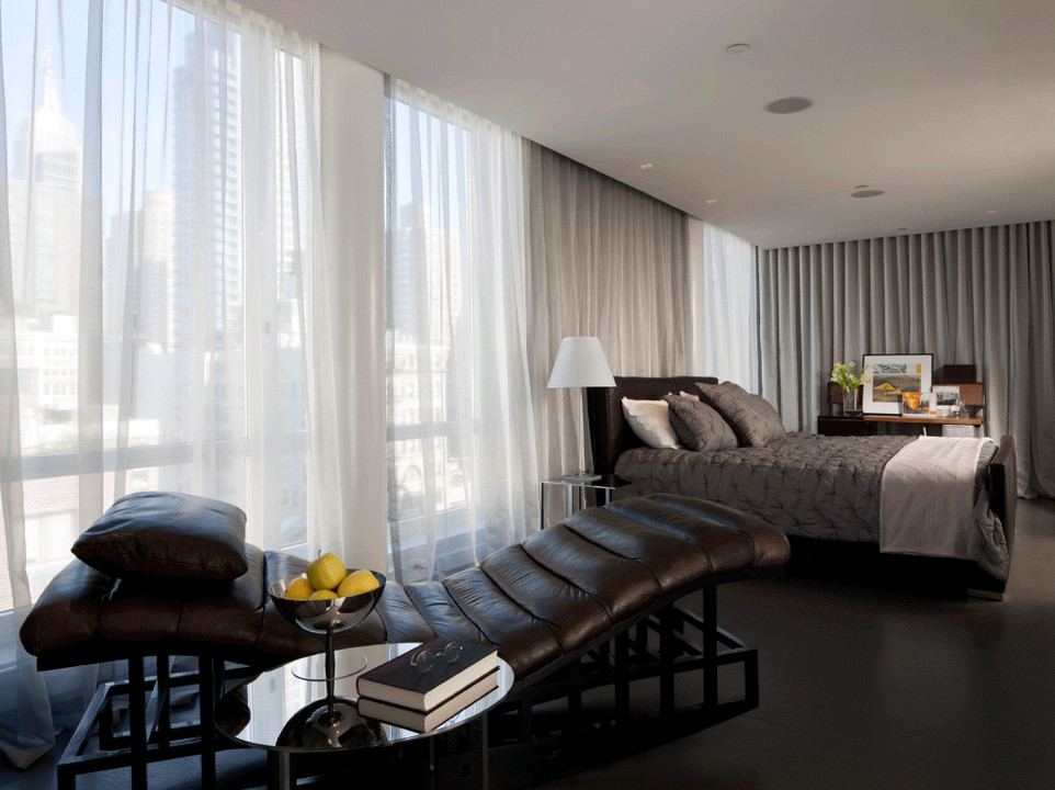 Photo of an expansive modern master bedroom in Other with grey walls and linoleum floors.