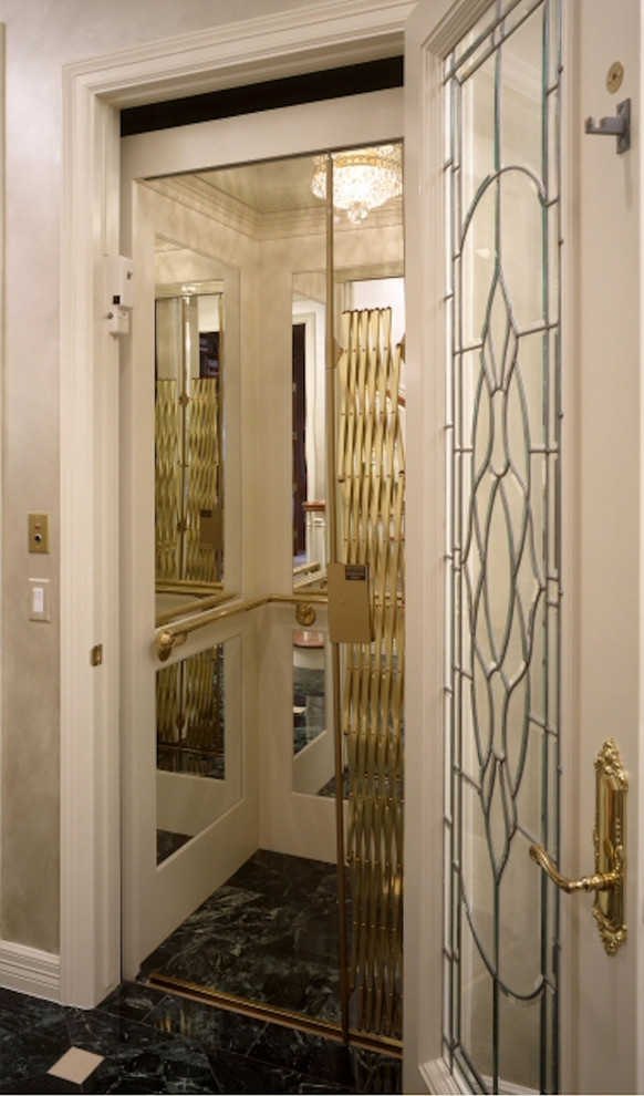 Example of a mid-sized transitional marble floor and black floor hallway design in Houston with white walls