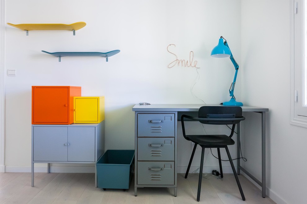 This is an example of a mid-sized industrial kids' bedroom for kids 4-10 years old and boys in Paris with white walls, light hardwood floors and white floor.