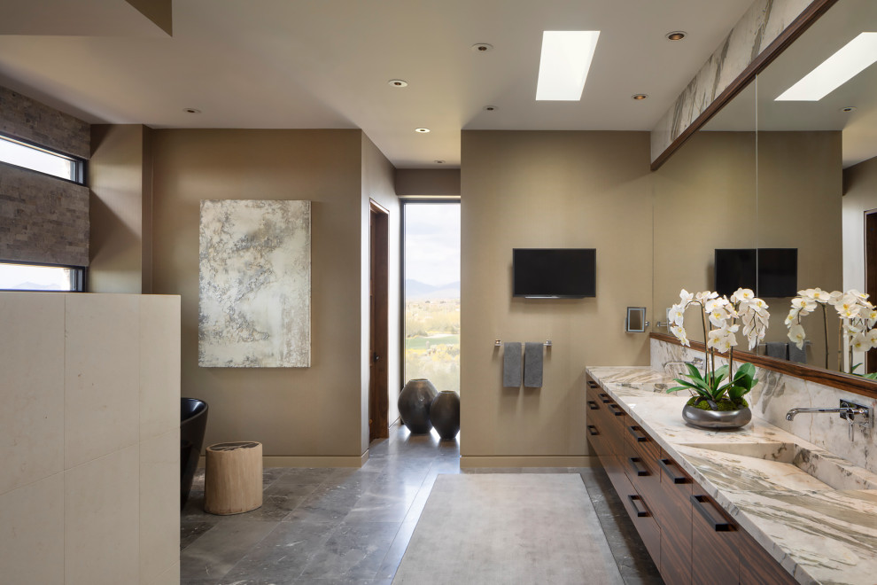 Design ideas for a large modern master wet room bathroom in Phoenix with furniture-like cabinets, dark wood cabinets, gray tile, limestone floors, a trough sink, quartzite benchtops, grey floor, a hinged shower door, a double vanity and a floating vanity.