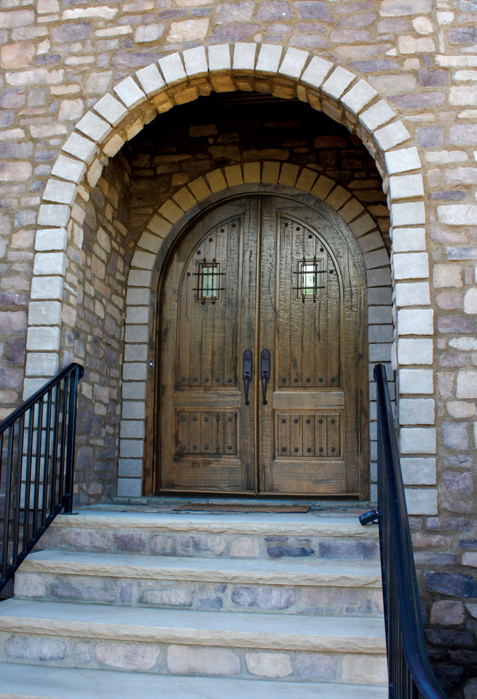 Front door - rustic front door idea in Raleigh with a medium wood front door