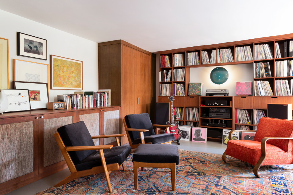 Family room - mid-sized 1960s enclosed gray floor family room idea in Los Angeles with a music area and white walls