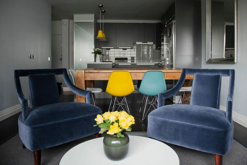 Inspiration for a mid-sized midcentury single-wall eat-in kitchen in London with flat-panel cabinets, grey cabinets, grey splashback, ceramic splashback, stainless steel appliances, dark hardwood floors and no island.