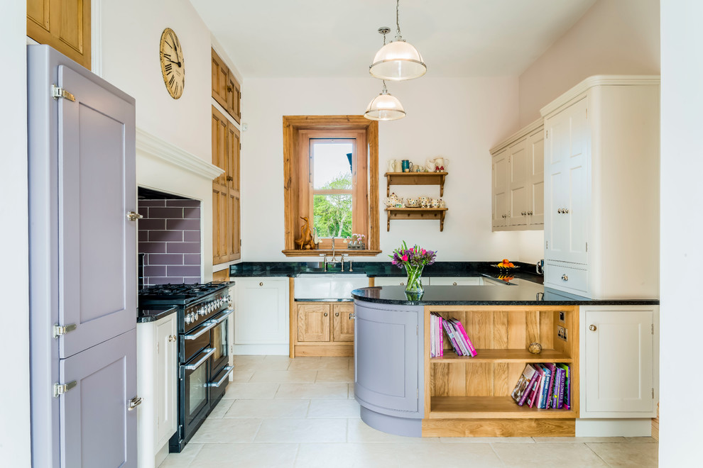 Mid-sized traditional u-shaped kitchen in Other with a farmhouse sink, granite benchtops, black appliances, shaker cabinets, purple cabinets, window splashback, a peninsula and white floor.