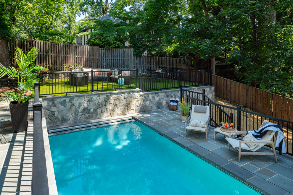 Huge transitional backyard stone and rectangular pool landscaping photo in DC Metro