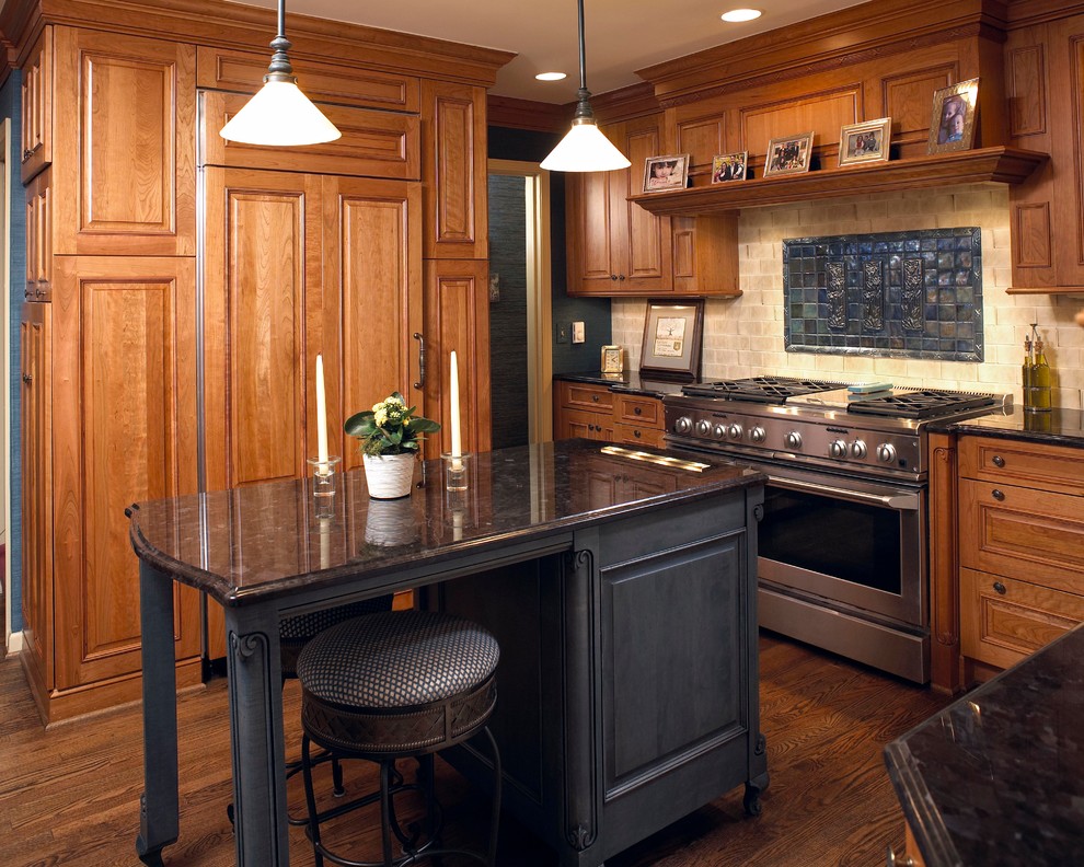 Photo of a small traditional separate kitchen in Detroit with raised-panel cabinets, with island, medium wood cabinets, beige splashback, panelled appliances and medium hardwood floors.