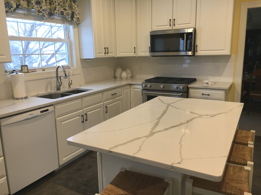 Home design - mid-sized transitional ceramic tile home design idea with an undermount sink, quartzite countertops, white backsplash and subway tile backsplash