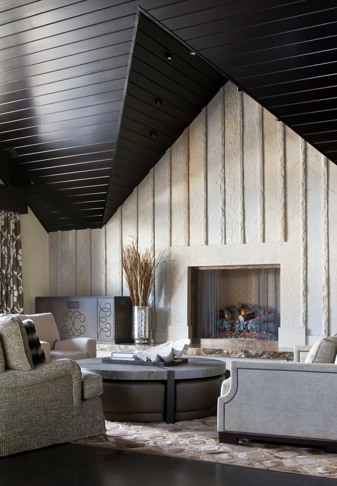 This is an example of a contemporary living room in Denver with a standard fireplace.