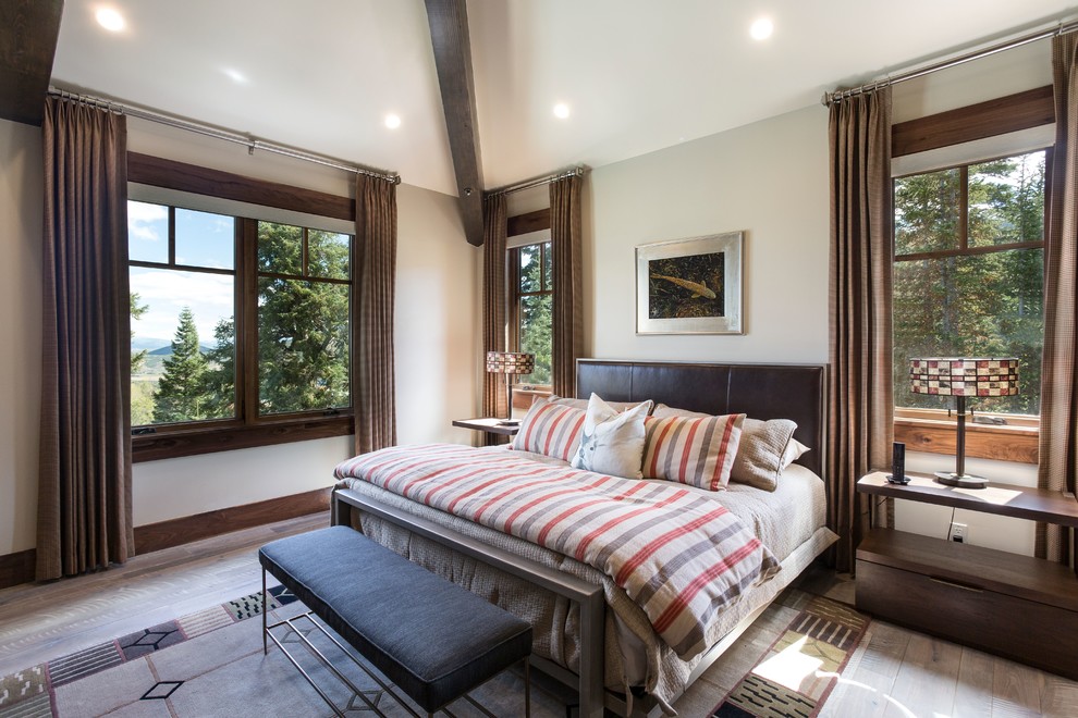 Inspiration for a country bedroom in Salt Lake City with grey walls, dark hardwood floors and brown floor.