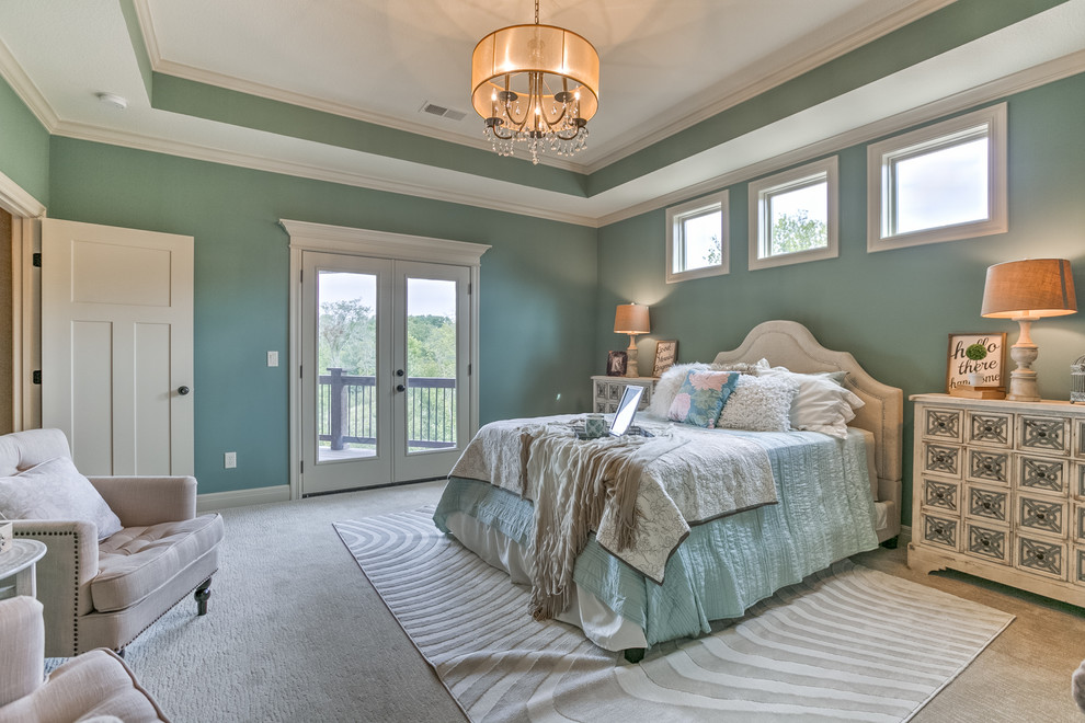 Design ideas for a large traditional master bedroom in Kansas City with green walls, carpet and white floor.