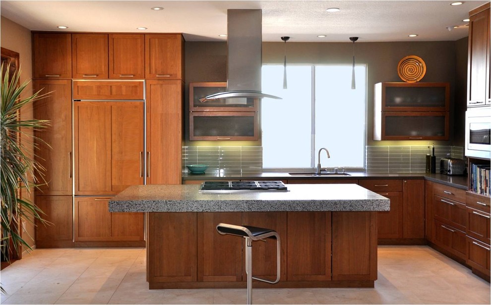 Design ideas for a mid-sized midcentury l-shaped open plan kitchen in San Diego with an undermount sink, shaker cabinets, medium wood cabinets, terrazzo benchtops, grey splashback, matchstick tile splashback, panelled appliances, ceramic floors, with island and beige floor.