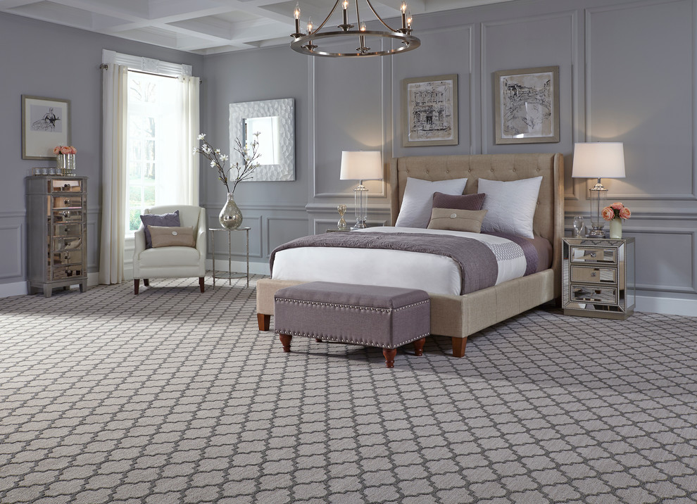 Design ideas for a large transitional master bedroom in New York with grey walls and carpet.