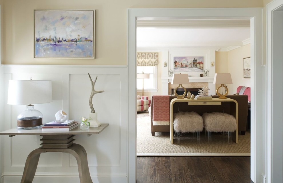 Example of a mid-sized transitional dark wood floor and brown floor foyer design in DC Metro with beige walls and a medium wood front door