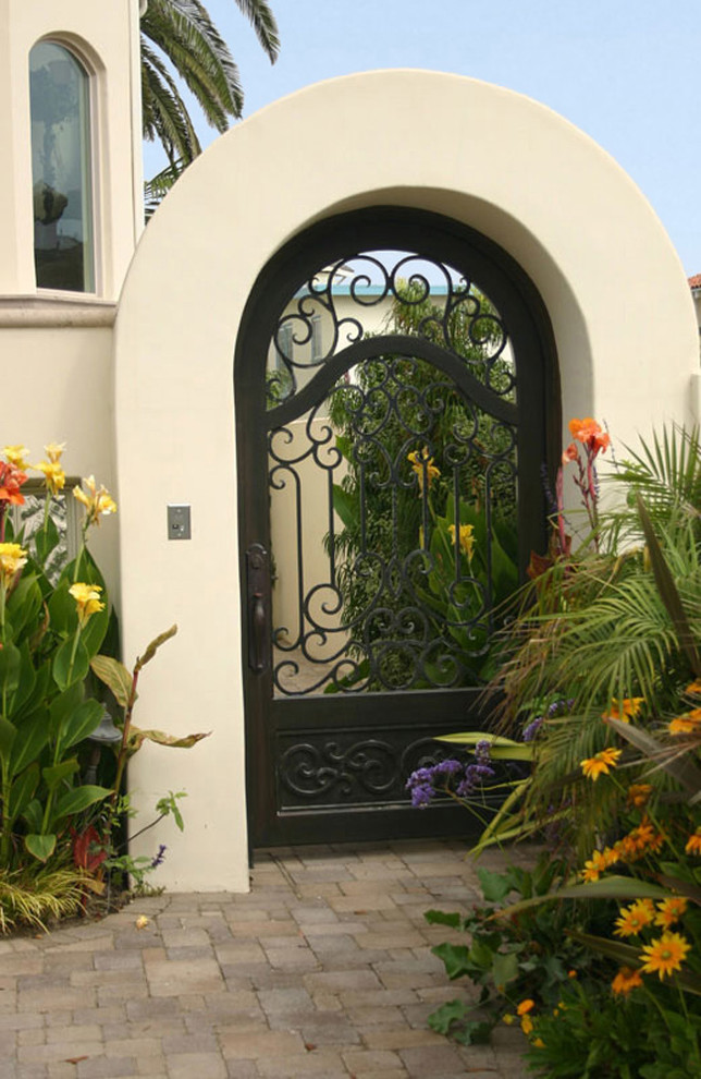 Home design - mid-sized mediterranean home design idea in Santa Barbara