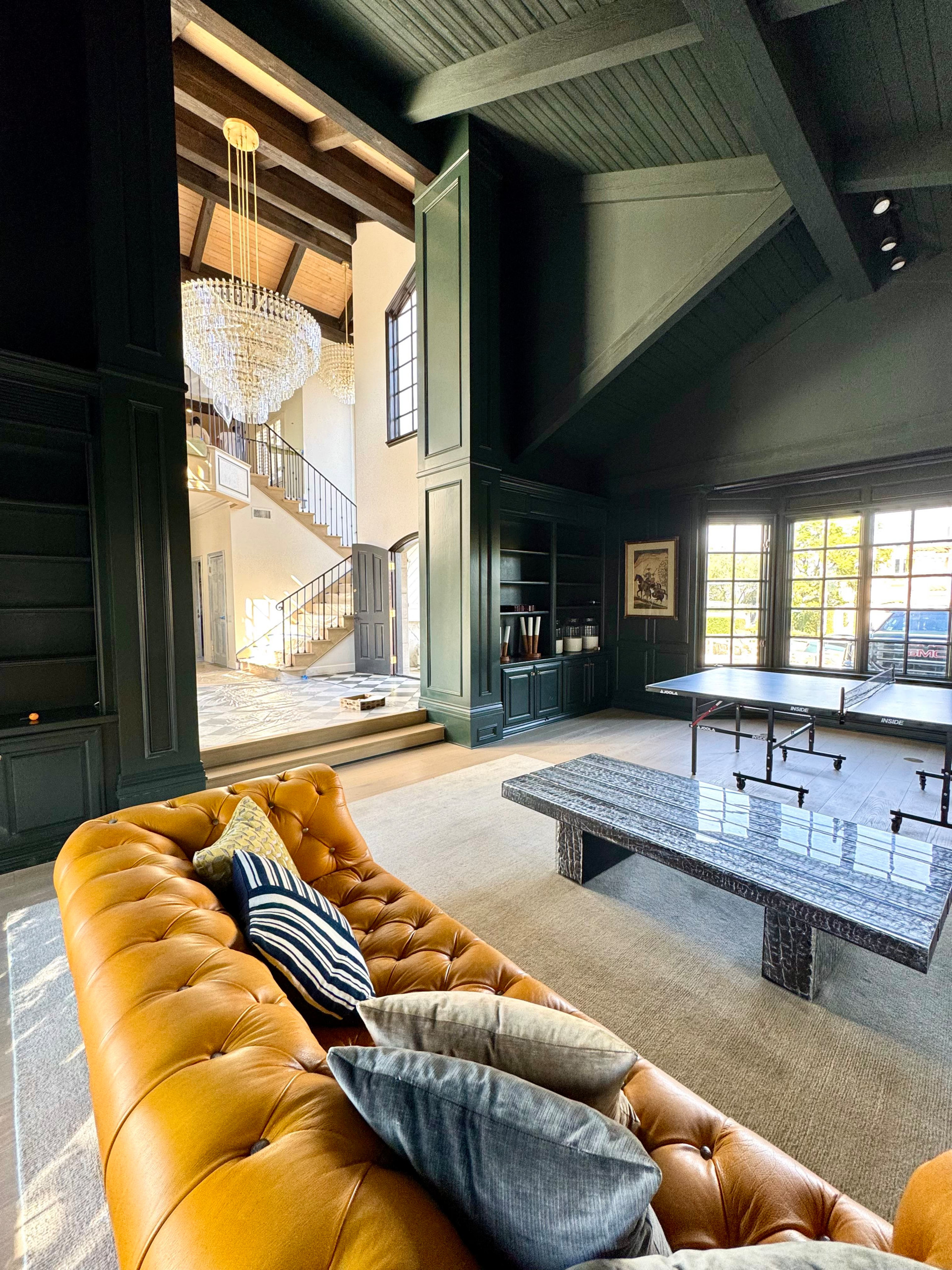 Family room - huge modern family room idea in Los Angeles with green walls