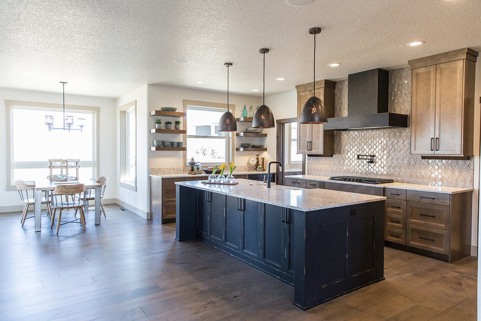 Large transitional u-shaped medium tone wood floor and brown floor eat-in kitchen photo with a farmhouse sink, shaker cabinets, medium tone wood cabinets, quartz countertops, beige backsplash, ceramic backsplash, black appliances, an island and multicolored countertops