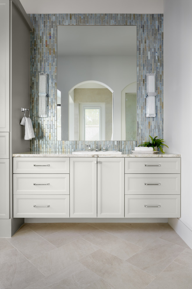 Transitional master bathroom in Houston with recessed-panel cabinets, white cabinets, multi-coloured tile, mosaic tile, white walls, a drop-in sink, beige floor, beige benchtops, a single vanity and a floating vanity.