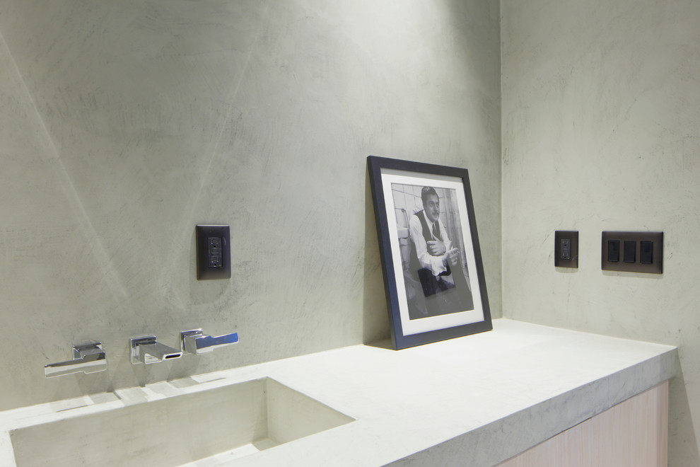 Design ideas for a contemporary bathroom in Miami with an integrated sink and concrete benchtops.
