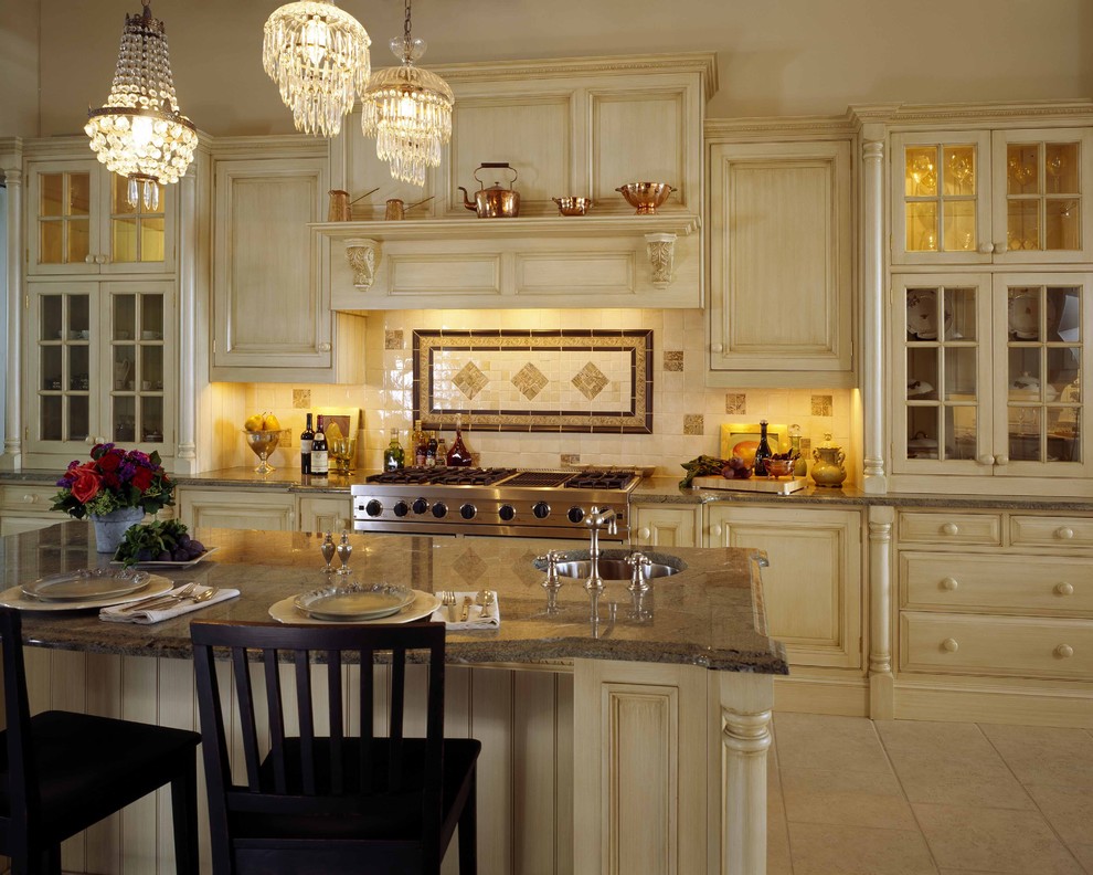 Photo of a traditional kitchen in Boston with glass-front cabinets, granite benchtops and beige cabinets.