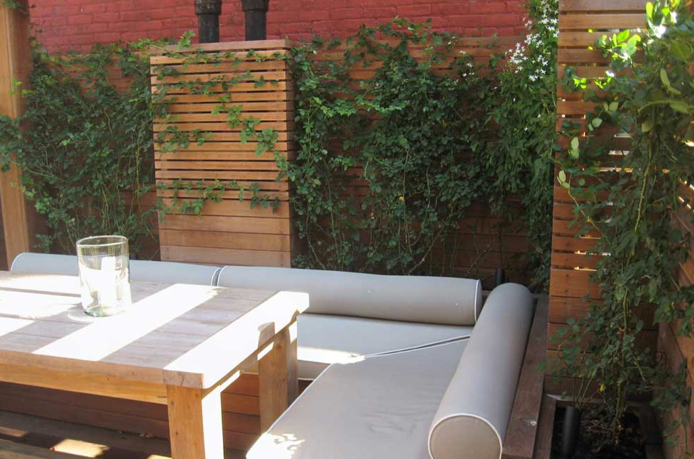 Design ideas for a large contemporary rooftop deck in New York with no cover and a container garden.