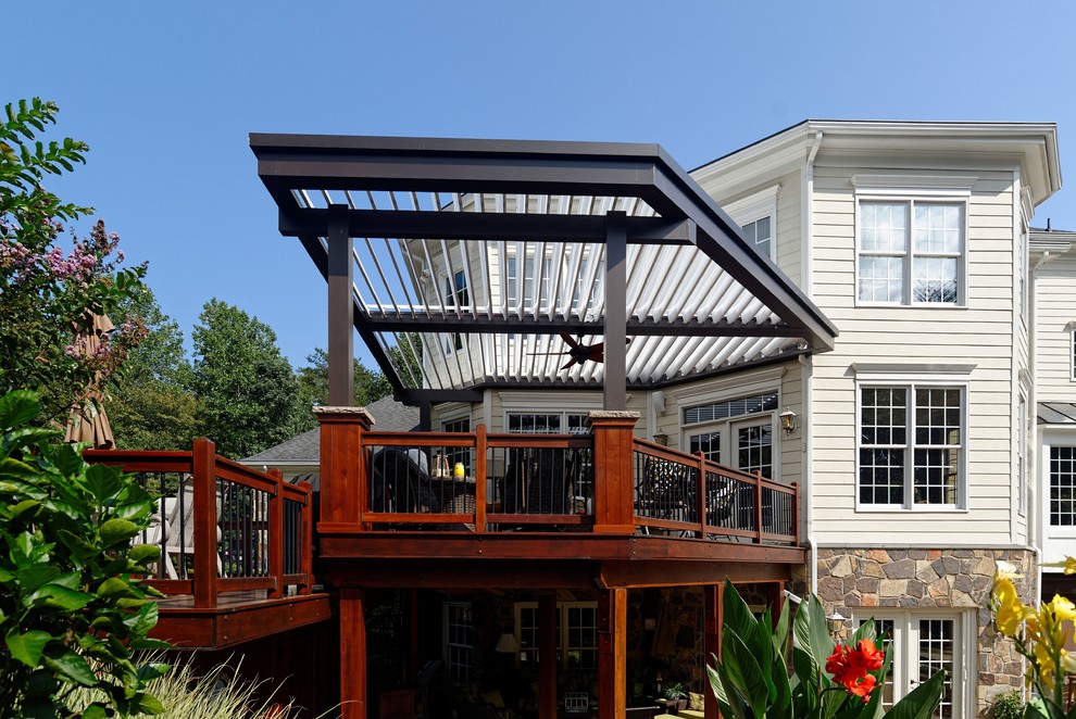 Photo of a mid-sized transitional backyard verandah in DC Metro with a pergola.