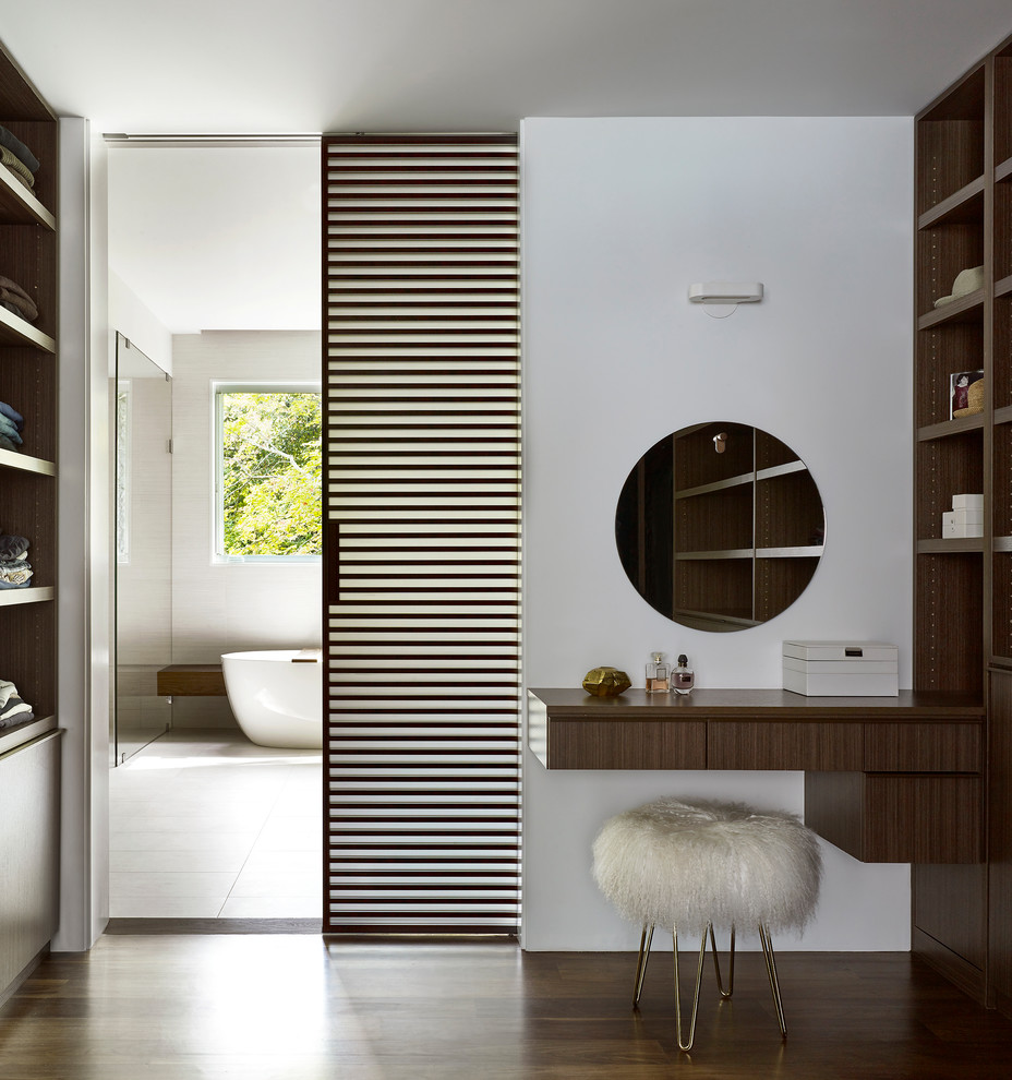 This is an example of a contemporary bathroom in New York with flat-panel cabinets, dark wood cabinets, a freestanding tub, a curbless shower, white walls, dark hardwood floors, wood benchtops, brown floor, an open shower and brown benchtops.