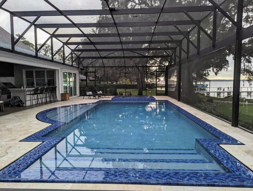 Inspiration for a large stone and custom-shaped hot tub remodel in Orlando
