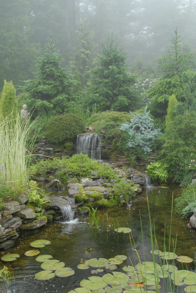 Design ideas for a traditional garden in Portland Maine with a water feature.