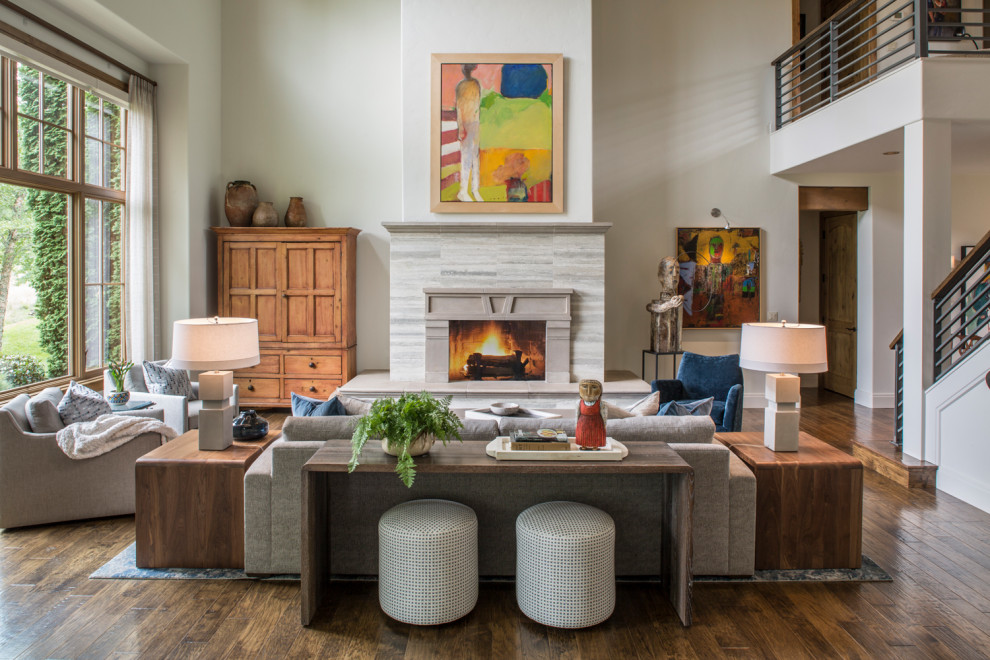 Mid-sized transitional open concept dark wood floor and brown floor living room photo in Other with white walls, a standard fireplace and a stone fireplace