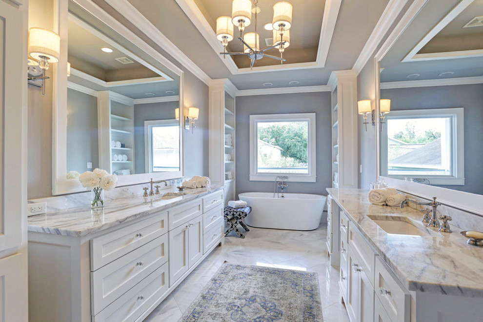 Inspiration for a mid-sized arts and crafts master bathroom in Houston with shaker cabinets, white cabinets, a freestanding tub, a double shower, grey walls, marble floors, an undermount sink, marble benchtops, multi-coloured floor, a hinged shower door, multi-coloured benchtops, a double vanity, a built-in vanity and coffered.