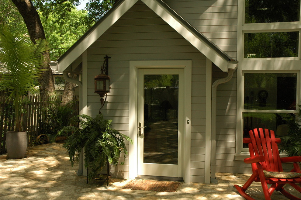 This is an example of a traditional front door in Austin with a single front door and a glass front door.