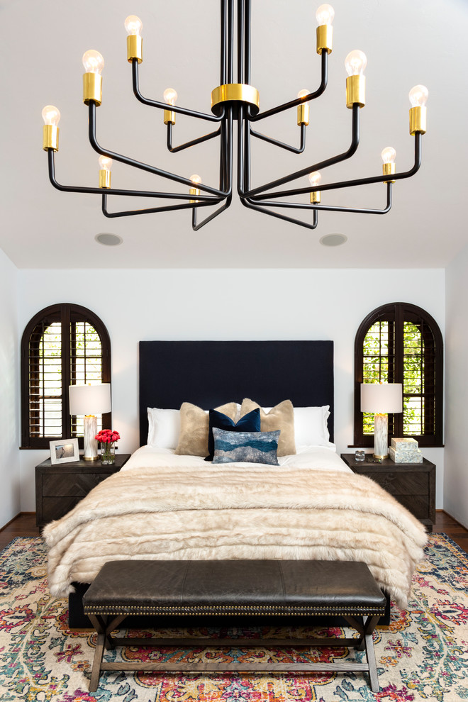 Mediterranean master bedroom in Other with white walls, dark hardwood floors and no fireplace.