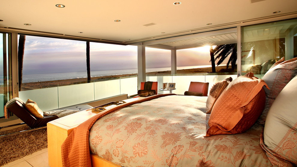 Photo of a large modern master bedroom in Orange County with beige walls and ceramic floors.