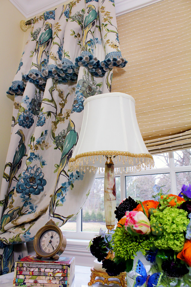 Traditional Rumson Home - Custom Priscilla panel draperies are tied back to frame the symmetry of the bed wall.  An inside mount roman shade is fully operable and controls the sunlight filtering through the windows.