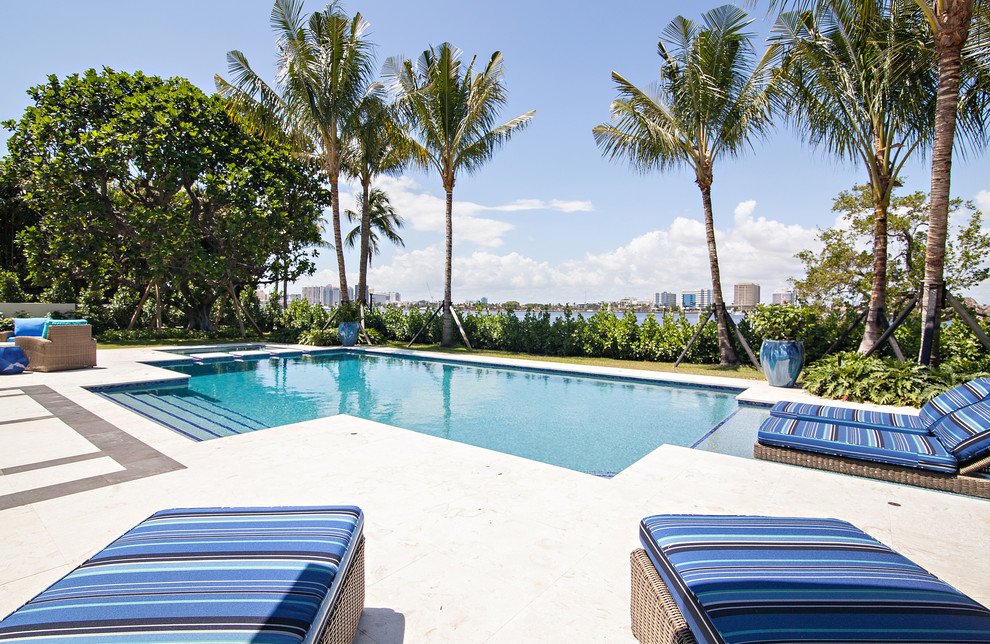 Huge transitional two-story white pool photo in Miami