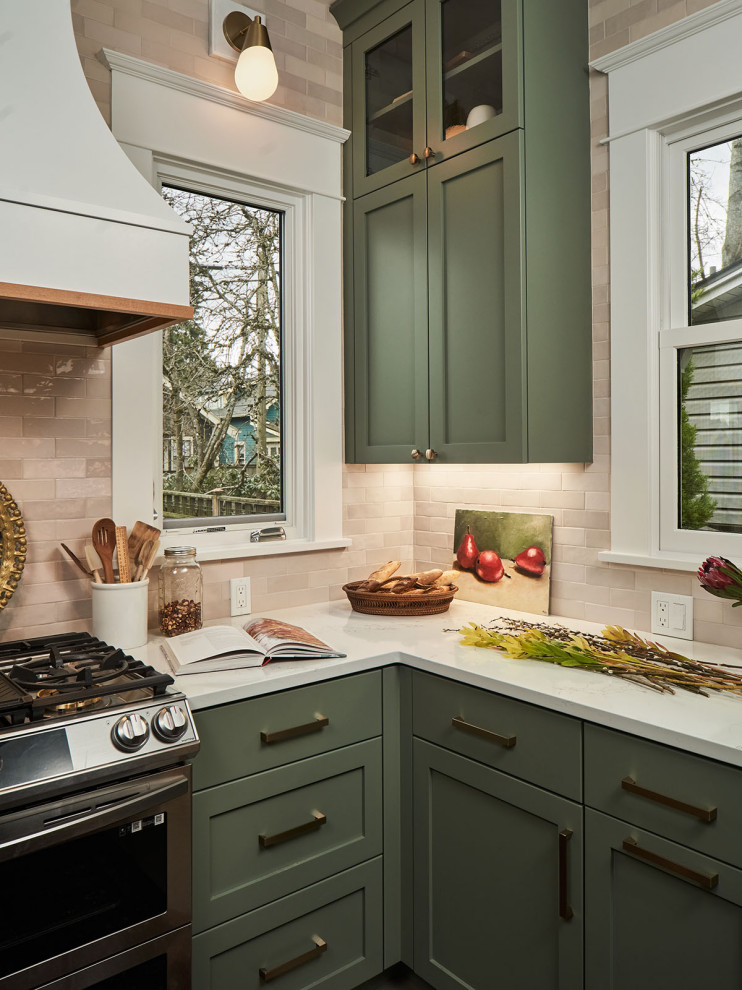 Eat-in kitchen - mid-sized transitional l-shaped beige floor eat-in kitchen idea in Portland with a farmhouse sink, shaker cabinets, green cabinets, quartzite countertops, beige backsplash, ceramic backsplash, no island and white countertops