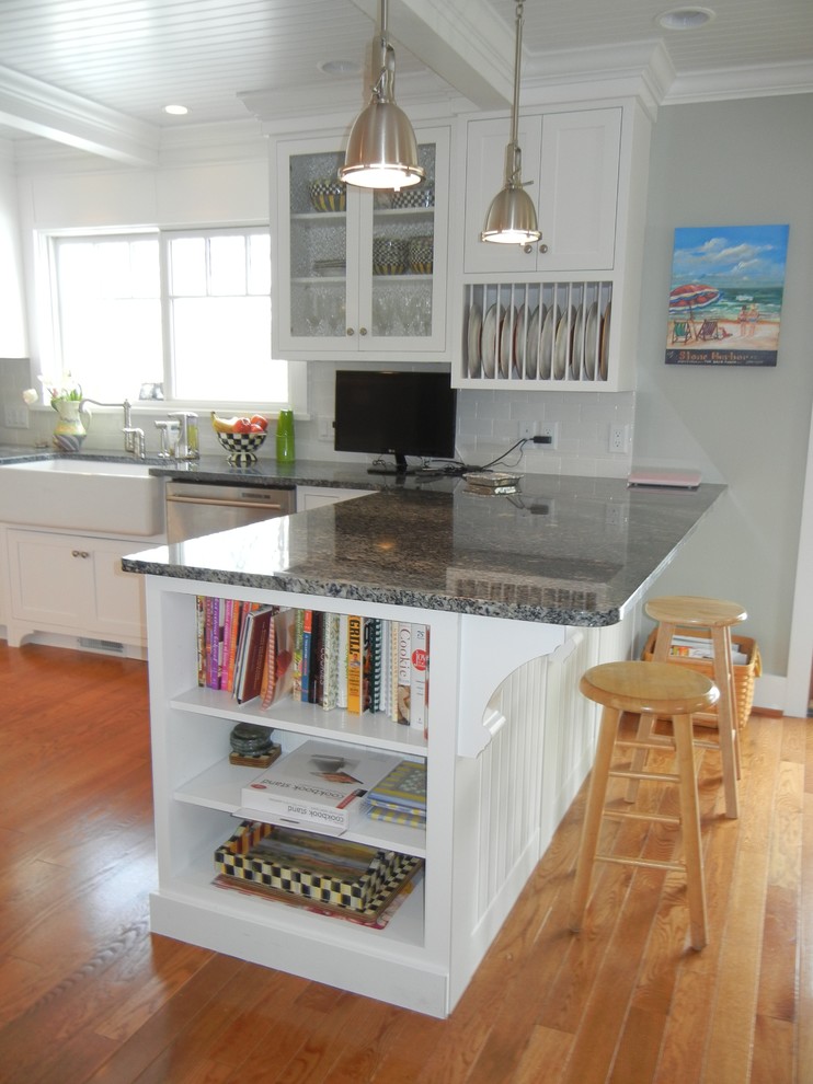 Inspiration for a large transitional u-shaped medium tone wood floor, brown floor and shiplap ceiling open concept kitchen remodel with a farmhouse sink, shaker cabinets, white cabinets, granite countertops, subway tile backsplash, stainless steel appliances, an island, white backsplash and gray countertops