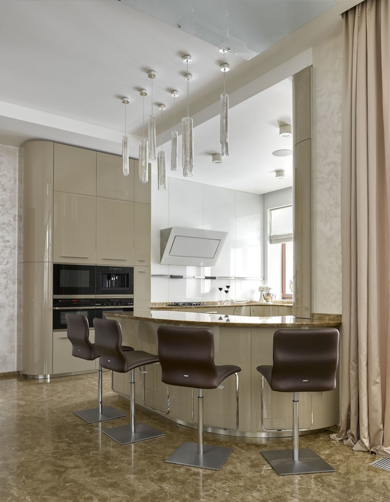 Design ideas for a large contemporary u-shaped open plan kitchen in Moscow with flat-panel cabinets, beige cabinets, marble benchtops, white splashback, glass sheet splashback, black appliances, marble floors, a peninsula and beige floor.