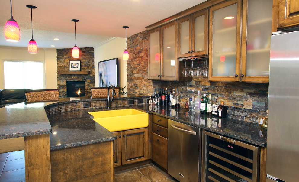 Seated home bar - transitional u-shaped seated home bar idea in Chicago with dark wood cabinets, multicolored backsplash and stone tile backsplash