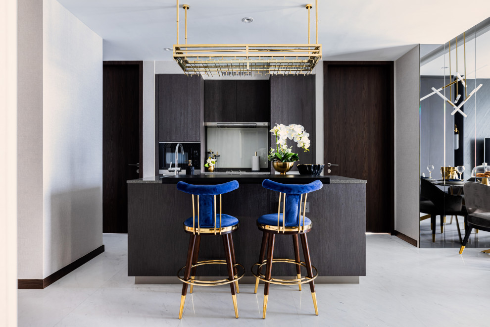 Contemporary kitchen in Singapore with flat-panel cabinets, dark wood cabinets, white splashback, with island, white floor and black benchtop.