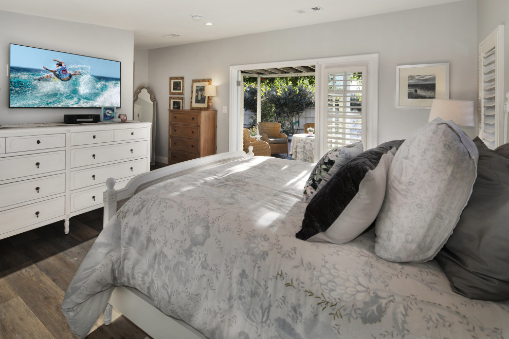 This is an example of a small beach style master bedroom in Orange County with blue walls.